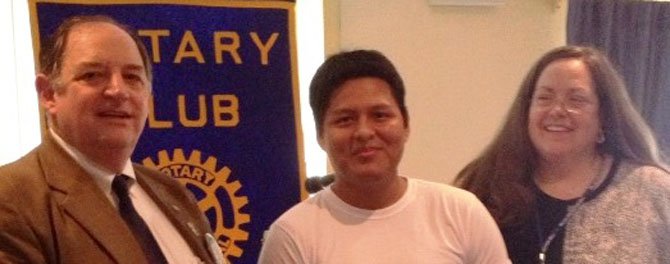 From left: Joseph Lott, president, Arlington Rotary Foundation; Edson Flores, stipend awardee, and Barbara Thompson, principal, Arlington Mill High School.
