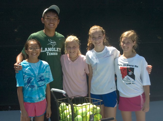 (From left): Julia Bullock, assistant coach Andrew Hwang, Emmy Mohler (homeschooled, age 12), Maria Baird and Callie Goodwin (Ambleside School, age 12) have all enjoyed summer lessons at Great Falls Swim and Tennis.