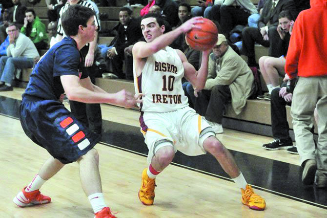 Bishop Ireton graduate Louis Khouri, with ball, will play basketball at Catholic University of America.