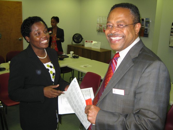 Karlene Sinclair-Robinson of the Business Finance Center and Thomas Ntuk of State Farm Insurance.
 