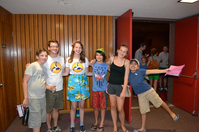 Cast and crew of the Traveling Players Middle School Ensemble Henry Hoagland, assistant director, Patrick Smith, assistant director, Ellie Robb, Clarke Paty, Emma Flye and Soven Bhagat, celebrate after the production.