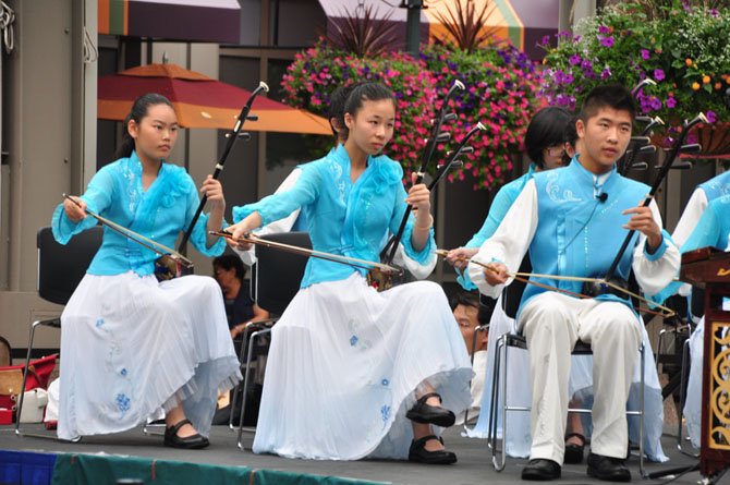 Erhu players with the Shanghai Yangpu Youth Palace student troupe perform at Reston Town Center Saturday, Aug. 10. 