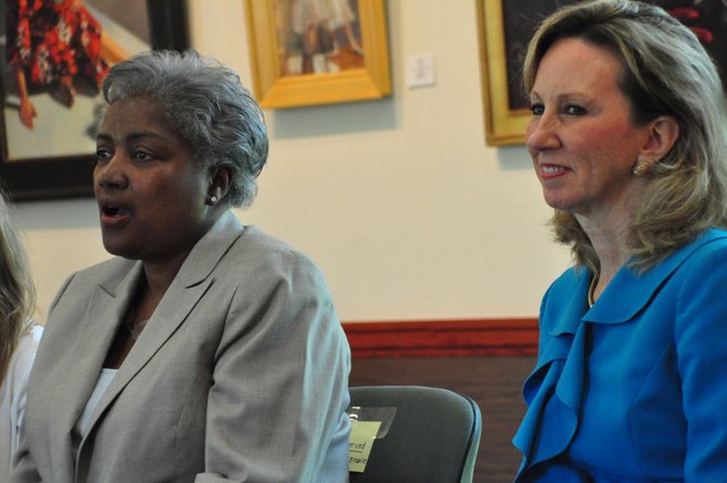 From left, Donna Brazile and Del. Barbara Comstock (R-34) speak to young women at the Great Falls Library Tuesday, Aug. 13. Brazile, who was the first African American woman to manage a presidential campaign with Al Gore in 2000, spoke to the women about pursuing their dreams. 