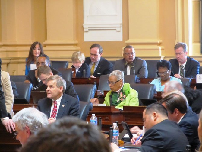 State Delegates Eileen Filler-Corn (D-41), far left, and David Bulova (D-37), far right, prepare bills in the lower house chamber during the 2012 General Assembly session. Both face challengers this November.
