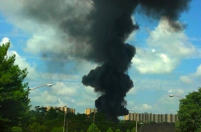 Heavy plumes of thick black smoke can be seen for miles.