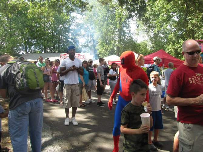 The young man unawares of the superhero behind him will really get a thrill should he attend this weekend’s Burke Centre Festival, Sept. 7 and 8, and spot Angry Birds roaming festival grounds.
