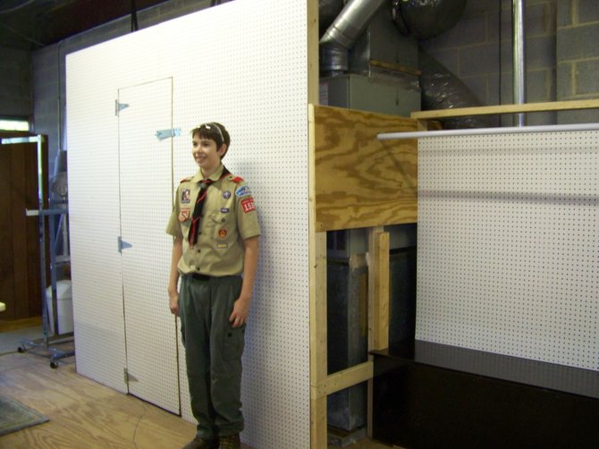 Austin David Nicholls of Oak Hill with the display area space he built for Pender's ReGift Thrift Store as part of his Eagle Project.
