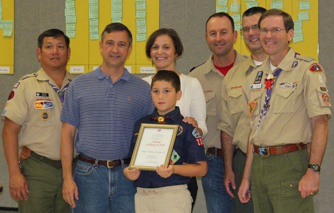 Pictured, from left, Byron Ing, unit commissioner, Old Dominion District; James Hughes (senior), Ike's father; Diana Hughes, Ike's mother; James "Ike" Hughes, the award recipient; Ben Akins, Pack 2000 cubmaster; Steve Waugh, Pack 2000 Webelos den leader, and Jim Stewart, district commissioner, Old Dominion District.
