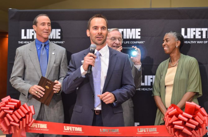 Miklos Horvath, a general manager at Life Time Fitness, speaks at the grand opening ceremony in Reston. Behind him are Mark Ingrao, Del. Ken Plum (D-36), and Supervisor Catherine M. "Cathy" Hudgins (D-Hunter Mill).