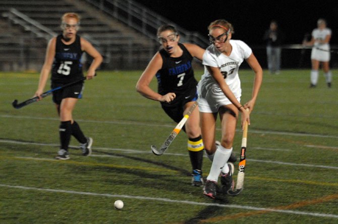 Westfield’s Emily McNamara, right, and Fairfax’s Sara Allen go for the ball during Tuesday’s contest at Westfield High School.