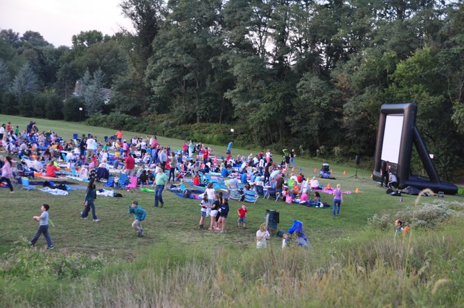 Families gather behind Colvin Run Elementary School Friday, Sept. 20 for their annual outdoor movie night. 