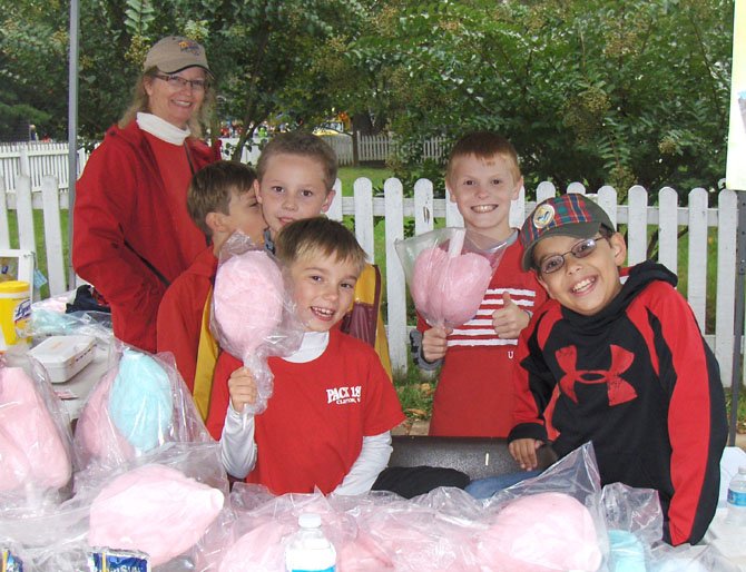 Selling cotton candy at last year’s Clifton Day are Dariece Rau, assistant leader of Clifton’s Cub Scout Pack 1861, with (back row, from left) Nick Richmond, Gannon Rau and Sean Cunningham and (front row, from left) Thomas Mikolashek and John Biamonte.