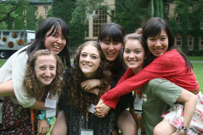 Maddy Naide (far left) with her roommate, Ayaka, on her back, as well as other roommate pairs enjoying free time on the Princeton Campus.
