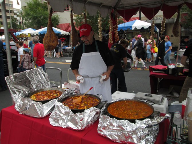 Josu Zubikarai, a chef with La Tasca in Clarendon, prepared three different kinds of paella, just some of the dozens of restaurant samples available during Clarendon Day. 
