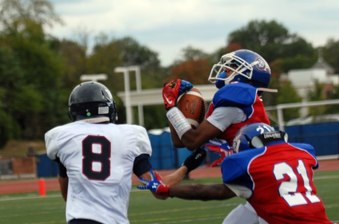 T.C. Williams defensive back Timmy Rattanaphone intercepted three passes against Woodson on Sept. 28.