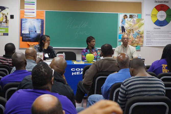 Dr. Bradley Ware, right, discusses diabetes awareness during the men's health seminar.