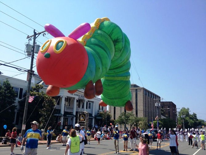 A giant caterpillar makes its way down Chain Bridge Road in Old Town Fairfax during the city’s 2012 Fall Festival.
