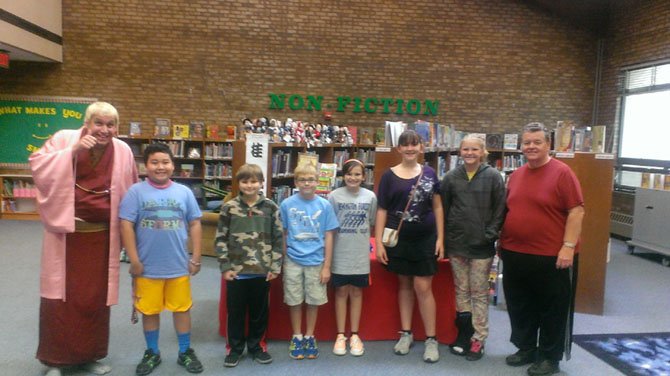 Students, from left, Peter Tran, Ryan Faiola, A.J. Muir, Megahn Zebrowski, Leah Tudor, Olivia H. pose with Sunshine Katsura (left) and Gary Lloyd (right).
