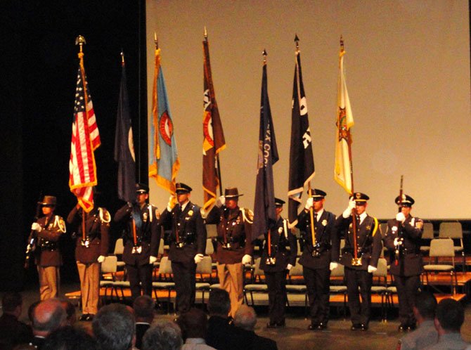 The Fairfax County Honor Guard presents the colors at the Criminal Justice Academy graduation.