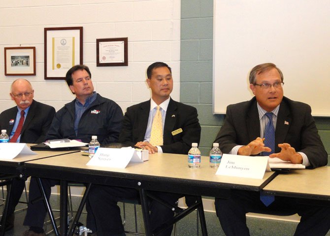 From left: Jerry Foltz, Tim Hugo and Hung Nguyen listen while Jim LeMunyon answers a question.