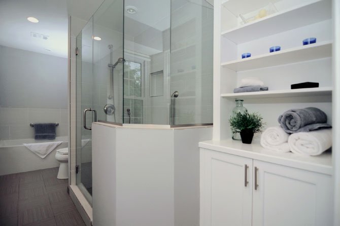 Designer Allie Mann added a frameless glass shower and extra storage space when she remodeled the master bathroom of this Alexandria home.
