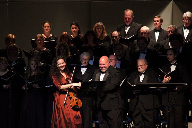 Jenny Oaks Baker and Gary Clawson with choir.