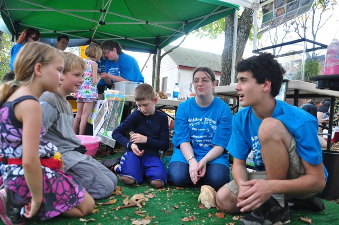 Volunteers from Nature’s Web, LLC explain the nature of toads to guests at the annual Runnymede Park NatureFest Sunday, Oct. 6. 