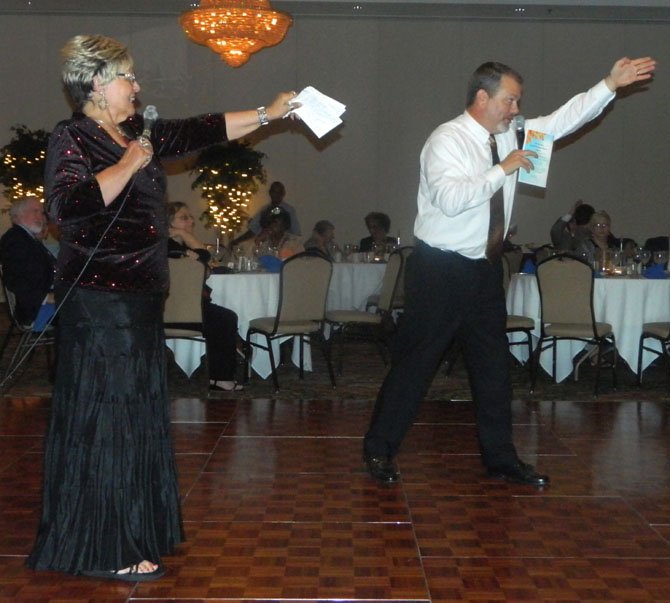 Gala organizer Sharon Emory and auctioneer Tim Dunbar brought in hefty bids. 