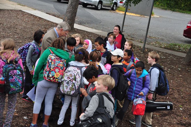 Supervisor John Foust (D-Dranesville) greets Spring Hill Elementary School students who biked or walked to school Wednesday, Oct. 9. 