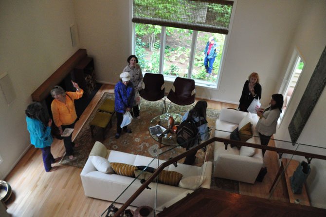 Reston Home Tour visitors explore the living room of Peter and Nedra Agnew Saturday, Oct. 19, one of the stops on the annual Reston Home Tour. 