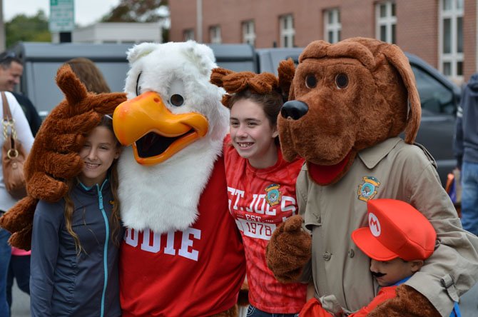 Eddie the Eagle and McGruff the Crime Dog pose for a picture. Students from St. Joseph's school in Herndon helped the costumed mascots. 
