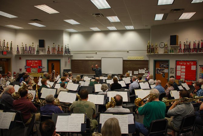 Robert Pouliot directs the City of Fairfax Band in a rehearsal at Washington Irving Middle School in Springfield.