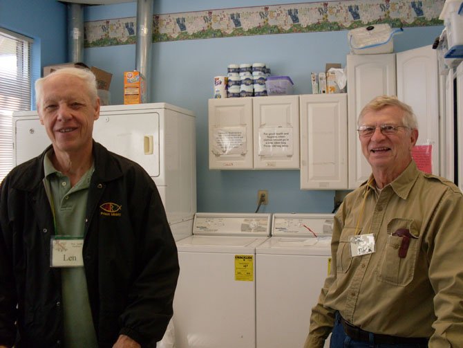 Volunteers Len Pomeroy and Dick Neff staffing the laundry.