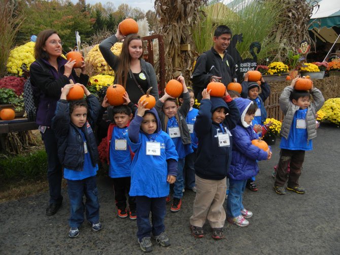 Students and teachers from Newington Forest Head Start in Springfield show off their pumpkins.