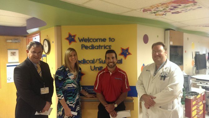 From left, Dr. David Ascher, chairman, Dept. of Pediatrics at Inova Children's Hospital, Joanna Fazio, public relations at Inova, Mike Speck and Dr. Brendan McCracken, Trauma and Surgical Critical Care Department.