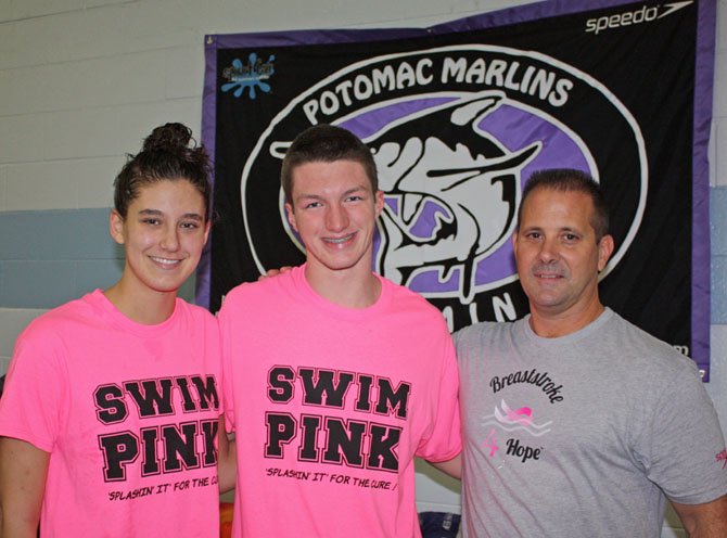 Marlins head coach Bill Marlin presenting NCSA Junior National Qualifiers Holly Jansen, of Clifton, and Kyle Marshall, of Alexandria, with caps for winning 400 IM in the 13 and over age group at the Marlins' fundraiser meet Saturday, Oct. 19.

