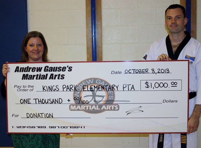 Andrew Gause gave $1,000 on behalf of his martial arts business to the Kings Park Elementary PTA.