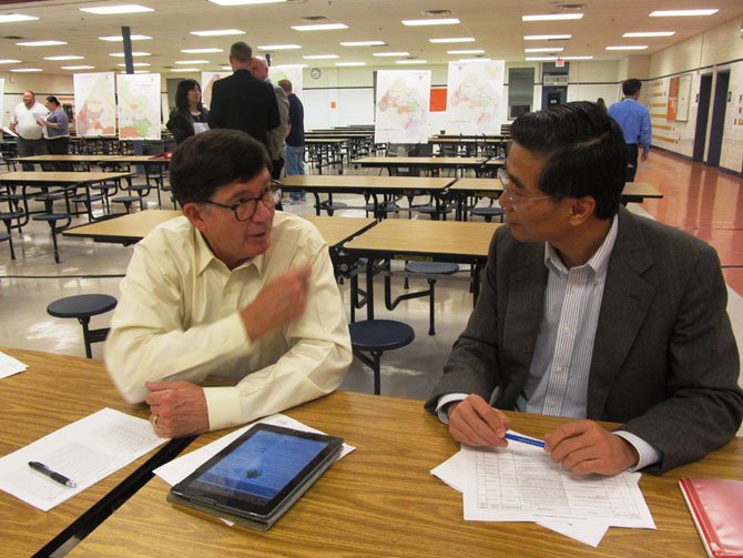 Alan Young of Burke, a member of FABB (Fairfax Advocates for Better Bicycling), talked with Jason Wu of Great Falls about the importance of bike and pedestrian-friendly transportation projects to ease congestion and make Fairfax County more "livable" at Hayfield High School Wednesday, Oct. 30. 