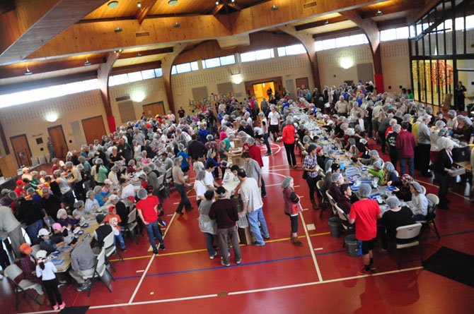 The Lutheran Redeemer church is filled with hundreds of volunteers packing nonperishable meals for Stop Hunger Now Saturday, Nov. 3. 