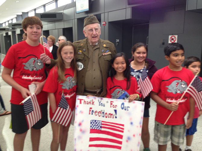 From left, Timothy Hutchinson, Caroline Keys, WWII Veteran Dick Graff, Sydney Pham, Angelina Rossi, Adit Khera.