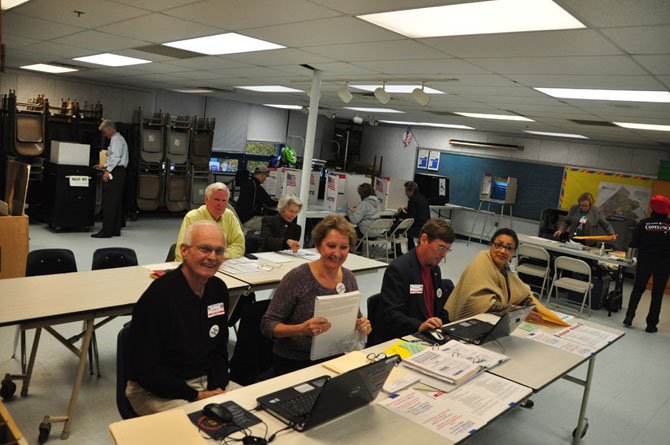 Election officers man the polling station at Churchill Road Elementary School Tuesday, Nov. 5. 