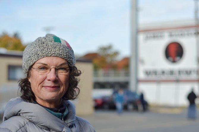 Vienna resident Kathy Moore handed out sample ballots to voters at the James Madison High School. 