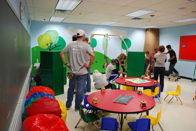 At Lynbrook Elementary School, the Sensory Room gets a makeover from Microsoft and MonkeeSee-MonkeeDo volunteers who painted wall, designed murals, and outfitted the room with new furniture and special technology during Saturday's makeover at Lynbrook.