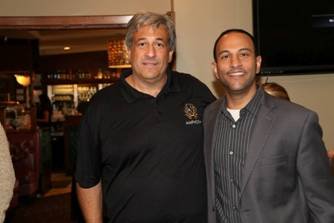 Amphora Owner George Cholakis stands with Eddie Fam, founder of the Meant 2 Live Foundation.
