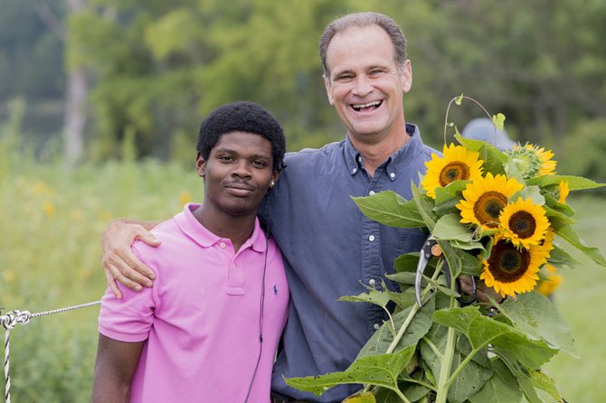 Dan Price of Reston, founder of Sweet Virginia Honey with Dante, a young man who is being mentored by volunteers with Fairfax Families4Kids.