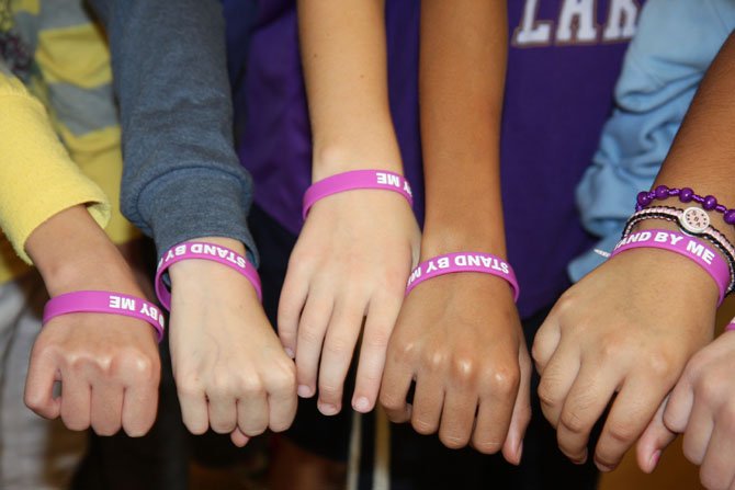 Lees Corner Elementary students show their “Stand by Me” wristbands.