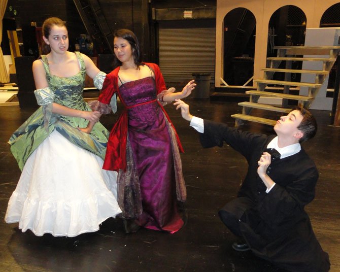 From left: Olivia Witt (as Maria) and Elizabeth Coo (as Olivia) are repulsed by the advances of Malvolio, played by Julian Sanchez. 