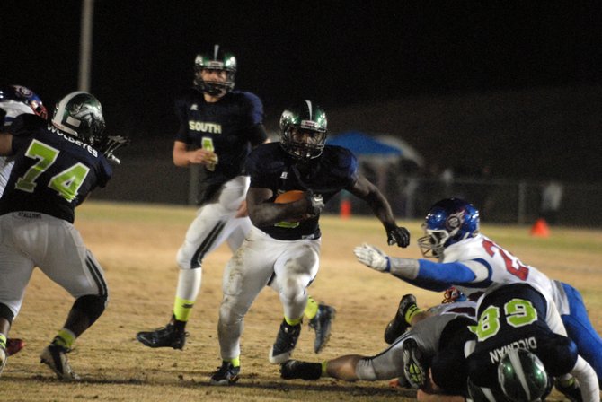 South County fullback Ed Kargbo rushed for 118 yards and three touchdowns against T.C. Williams during the teams' 6A North region football playoff game on Friday night at South County High School.