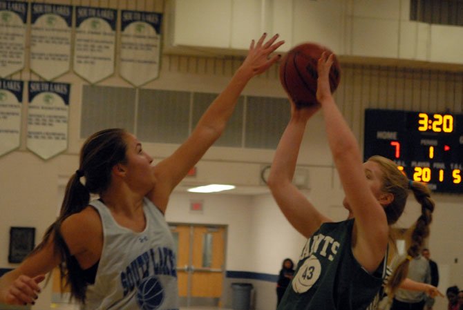 Six-foot-4 senior Abby Rendle, left, is one of nine returning athletes on the 2013-14 South Lakes girls’ basketball team.