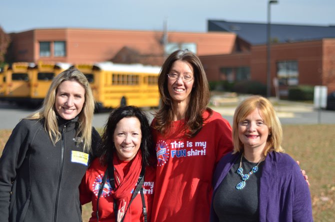 The 2012-13 Dranesville Elementary PTA Officers (from left) Christine Brinson, PTA Vice President, Kelly Smith, PTA Correspondence Secretary, Kim Baker Recording Secretary, and Rachel Gross, PTA President. In the background is Dranesville Elementary. 